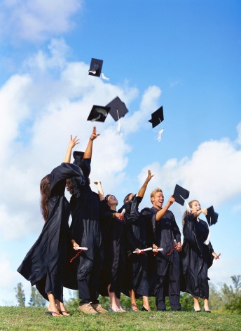 Group of Young Graduates Throwing Their Hats in the Air